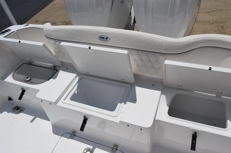 Slide: The Image of 2026 Sea Hunt Ultra 275 SE boat storage compartments and seating area. - 31