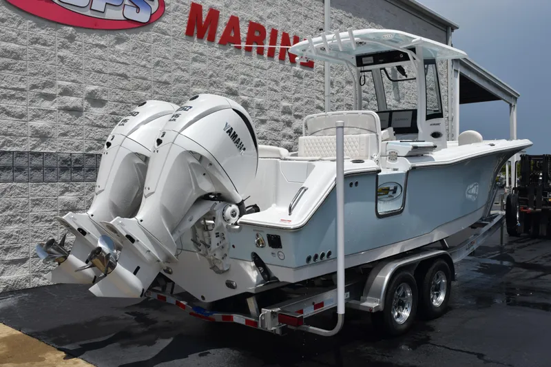 Slide: The Image of 2026 Sea Hunt Ultra 275 SE boat with twin Yamaha engines on a trailer. - 4