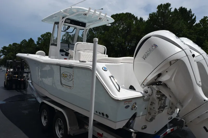 Slide: The Image of 2026 Sea Hunt Ultra 275 SE boat with Yamaha outboard engine on trailer. - 6