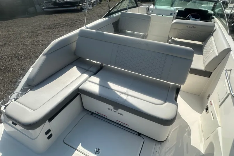 Slide: The Image of 2023 Sea Ray SDX 250 Outboard boat interior with spacious seating and modern design. - 20