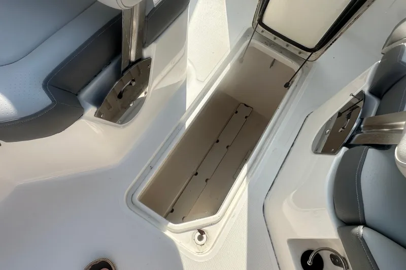 Slide: The Image of 2023 Sea Ray SDX 250 Outboard interior storage compartment with seating detail. - 24