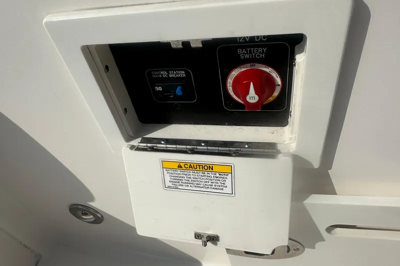 Slide: The Image of Battery switch panel on 2023 Sea Ray SDX 250 Outboard boat. - 26
