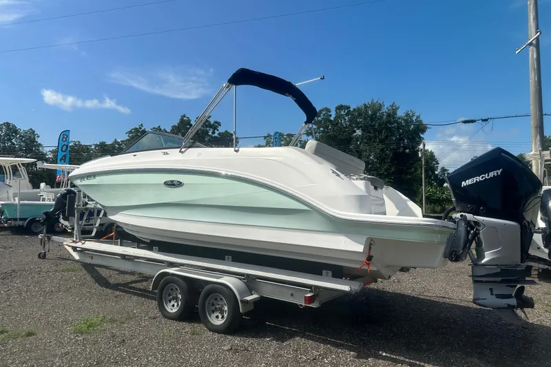 Slide: The Image of 2023 Sea Ray SDX 250 Outboard boat on trailer, sunny day, clear sky. - 3