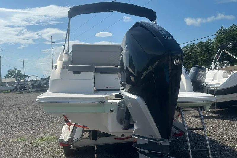 Slide: The Image of 2023 Sea Ray SDX 250 Outboard boat with powerful engine, parked outdoors. - 4