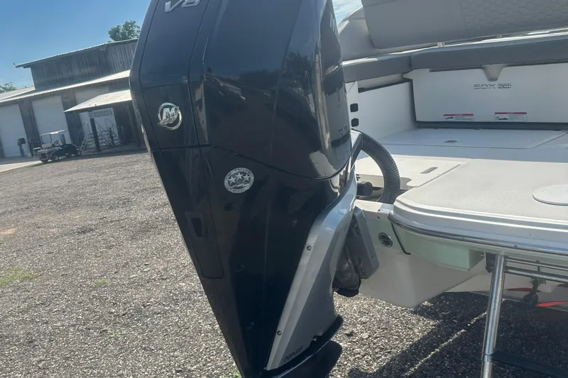 Slide: The Image of 2023 Sea Ray SDX 250 Outboard boat with powerful V8 engine, docked outdoors. - 6