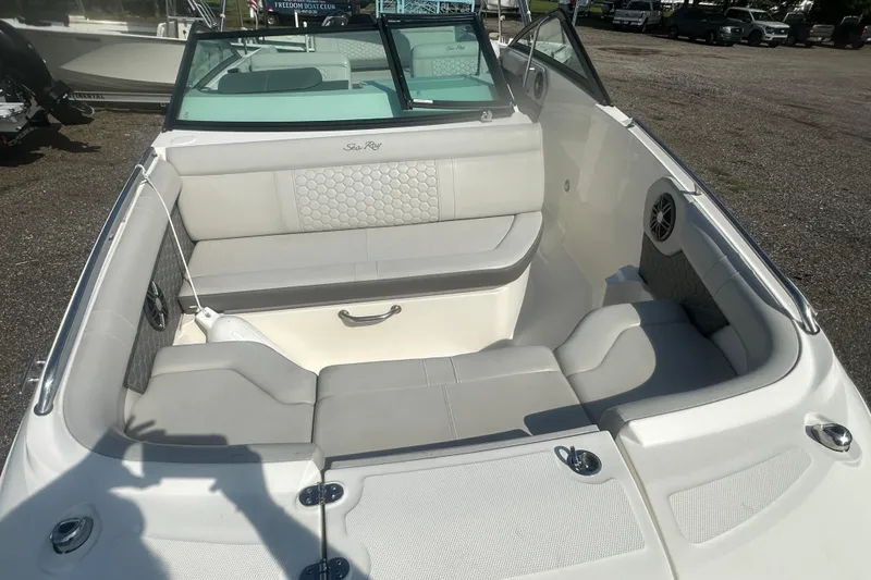 Slide: The Image of 2023 Sea Ray SDX 250 Outboard boat interior with spacious seating and modern design. - 9
