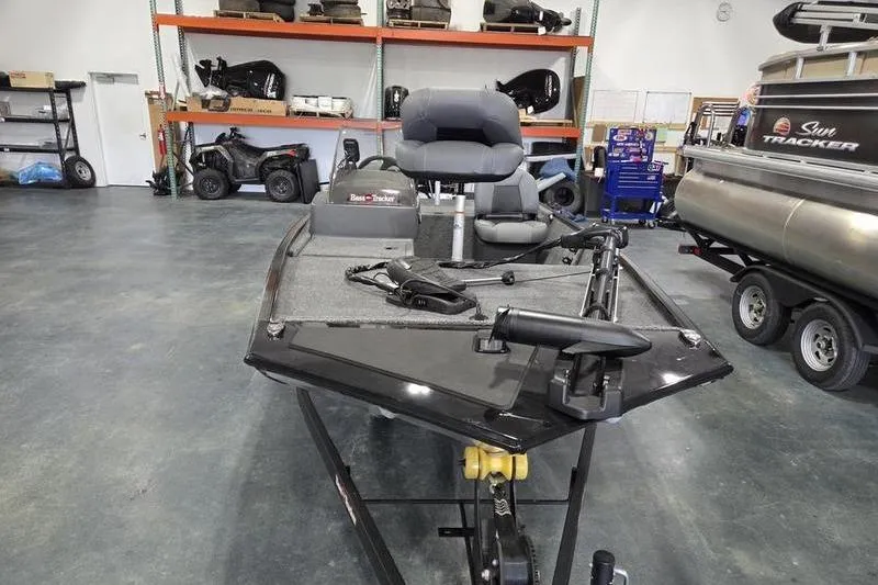 Slide: The Image of 2026 Tracker BT CLASSIC XL boat in showroom, featuring seating and equipment. - 4