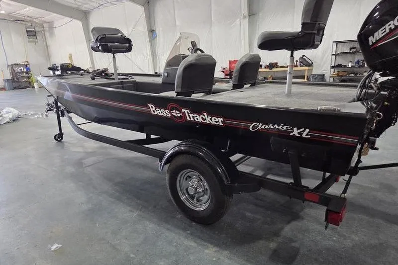 Slide: The Image of 2026 Tracker BT CLASSIC XL boat in a garage, featuring Bass Tracker branding. - 6