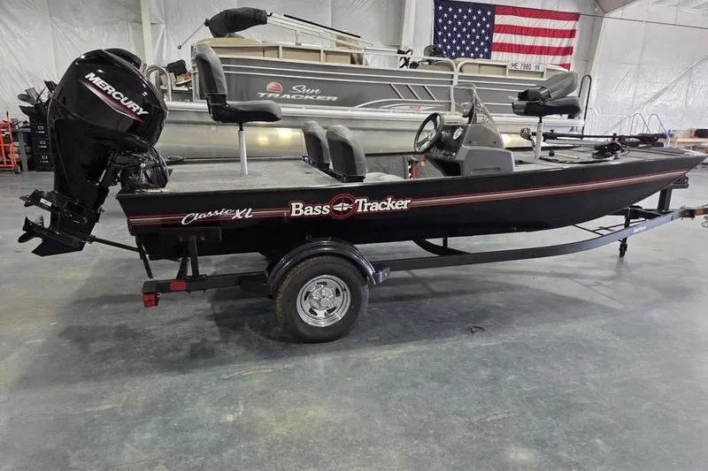 Slide: The Image of 2026 Tracker BT CLASSIC XL boat with Mercury engine in showroom. - 7