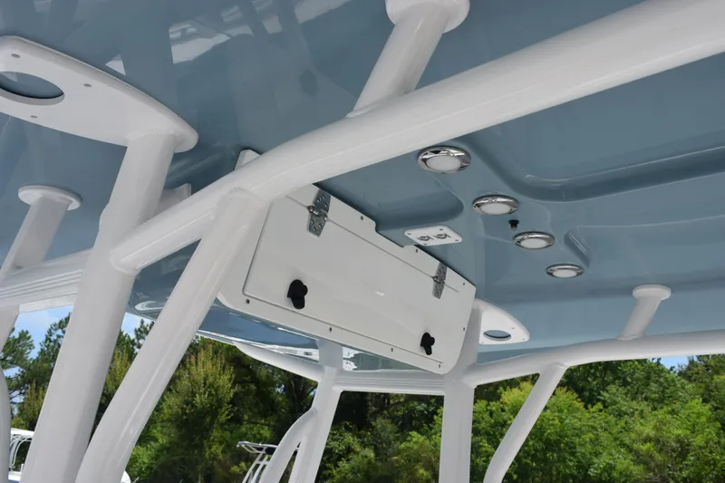 Slide: The Image of 2026 Sea Hunt Ultra 219 boat T-top with integrated lighting and storage. - 10