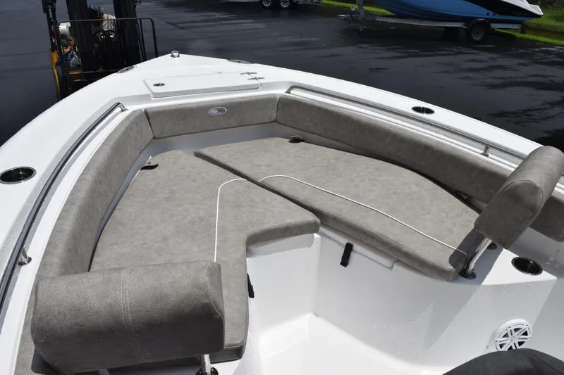 Slide: The Image of 2026 Sea Hunt Ultra 219 boat with spacious gray seating and sleek design. - 13