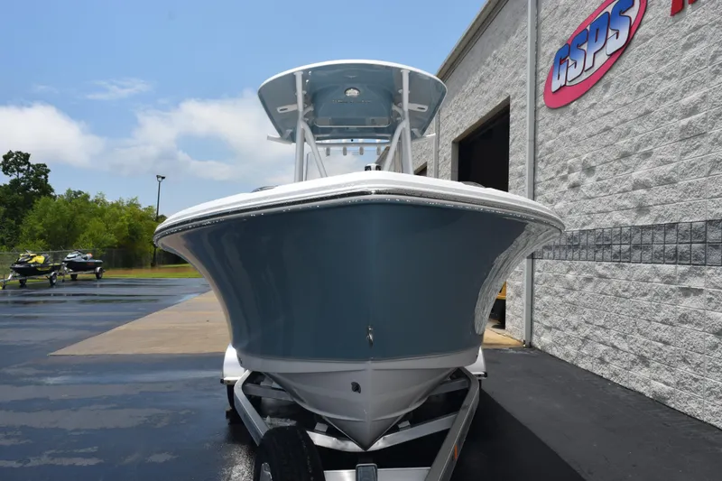 Slide: The Image of 2026 Sea Hunt Ultra 219 boat on trailer outside dealership. - 3