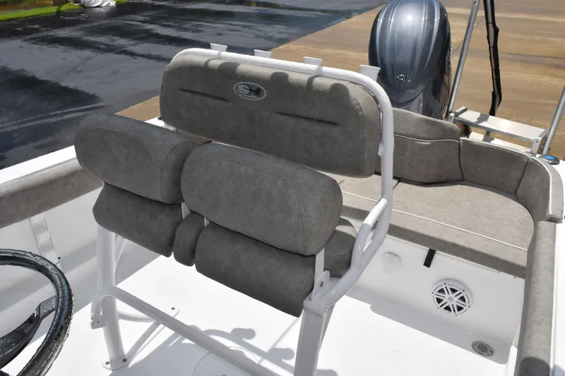 Slide: The Image of 2026 Sea Hunt Ultra 219 boat interior with cushioned seating and steering wheel. - 7