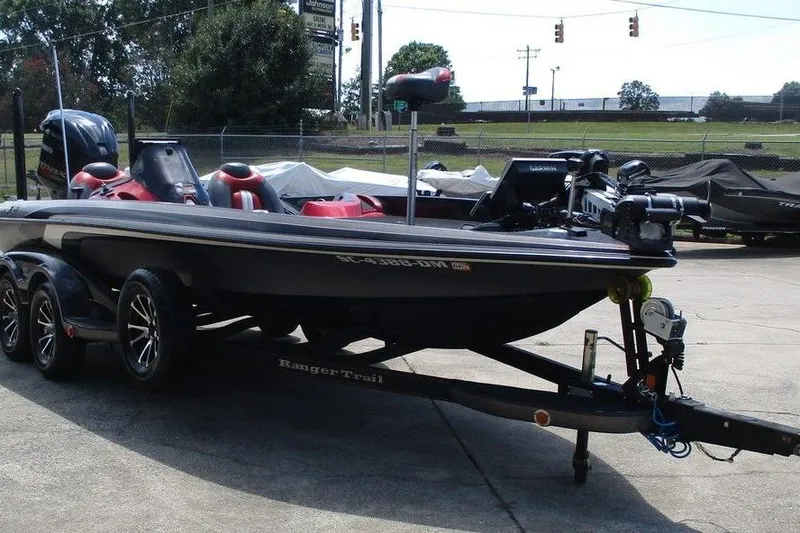 Slide: The Image of 2010 Ranger Z520 boat on trailer, parked outdoors, featuring sleek design and modern equipment. - 4