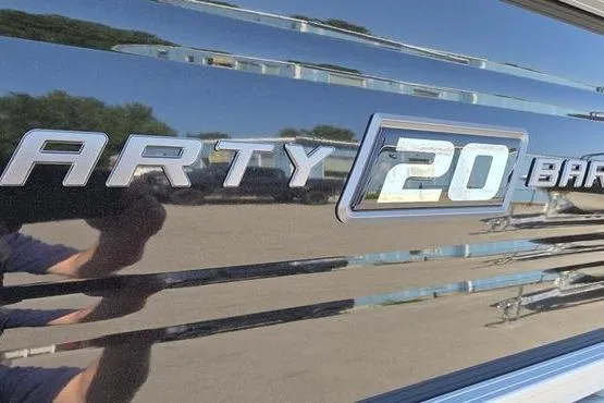 Slide: The Image of 2026 Sun Tracker PB 20 DLX boat logo with reflective surface. - 10