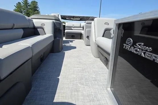 Slide: The Image of 2026 Sun Tracker PB 20 DLX pontoon boat interior with gray seating and flooring. - 11