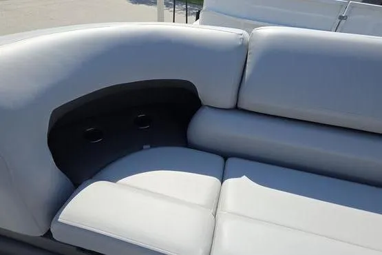 Slide: The Image of 2026 Sun Tracker PB 20 DLX boat interior with plush white seating. - 12