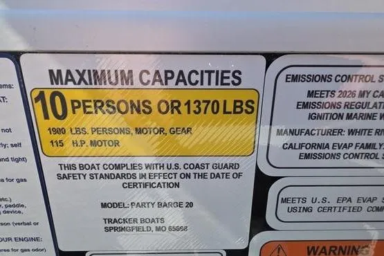 Slide: The Image of 2026 Sun Tracker PB 20 DLX capacity label: 10 persons or 1370 lbs, 115 HP motor. - 15