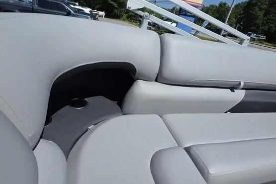 Slide: The Image of 2026 Sun Tracker PB 20 DLX boat interior with gray seating and cup holder. - 17