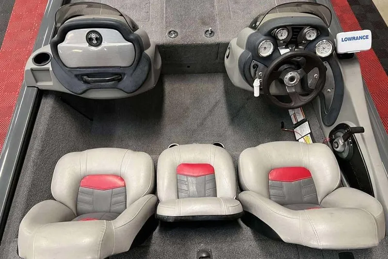 Slide: The Image of 2026 Tracker Pro Team™ 190 TX boat interior with steering console and seating. - 4