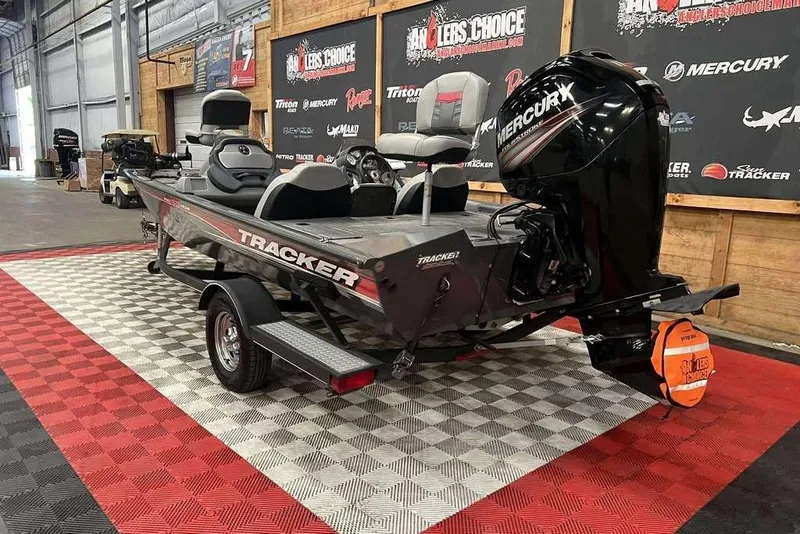 Slide: The Image of 2026 Tracker Pro Team™ 190 TX boat with Mercury engine in showroom display. - 5