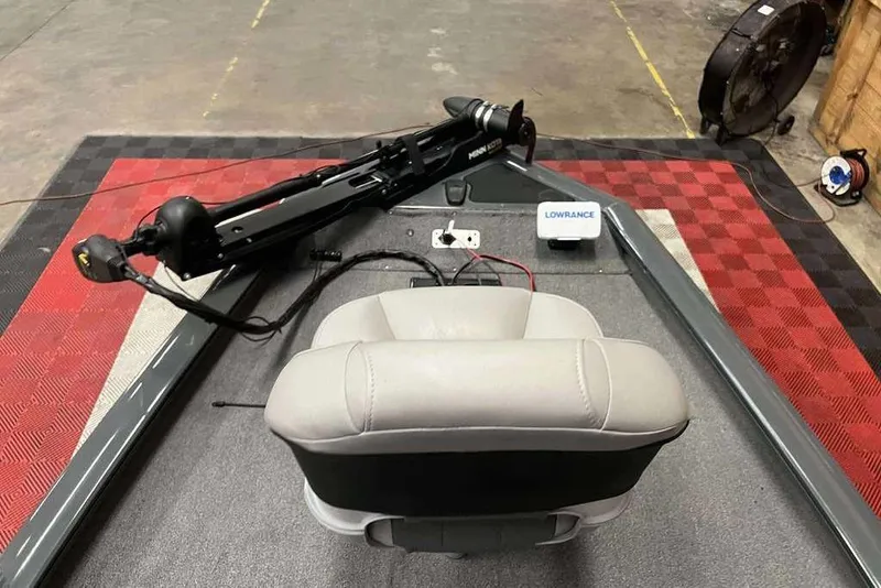 Slide: The Image of 2026 Tracker Pro Team™ 190 TX boat interior with seat, trolling motor, and Lowrance device. - 6