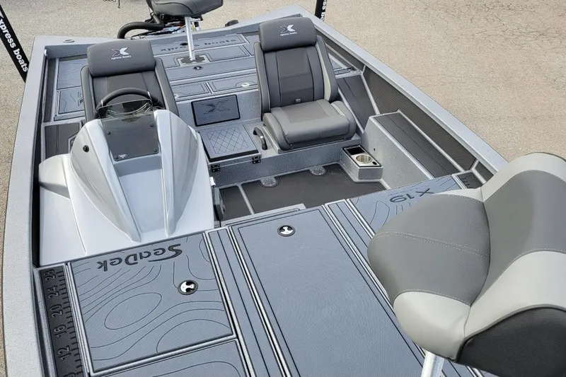 Slide: The Image of 2026 Xpress X19 Pro Bass boat interior with Yamaha Vmax 200 SHO, featuring sleek seating and design. - 3