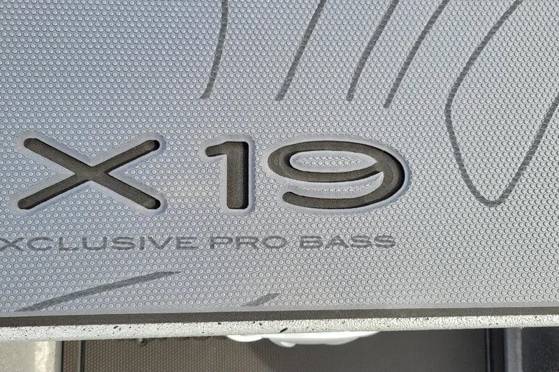 Slide: The Image of Xpress X19 Pro Bass boat floor detail, 2026 model, textured surface. - 4