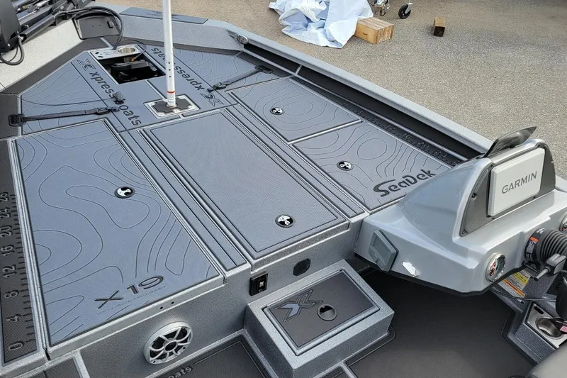 Slide: The Image of 2026 Xpress X19 Pro Bass boat deck with Garmin system and SeaDek flooring. - 6