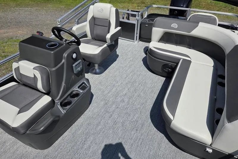 Slide: The Image of 2026 Sun Tracker BB 18 DLX pontoon boat interior with seating and steering console. - 11