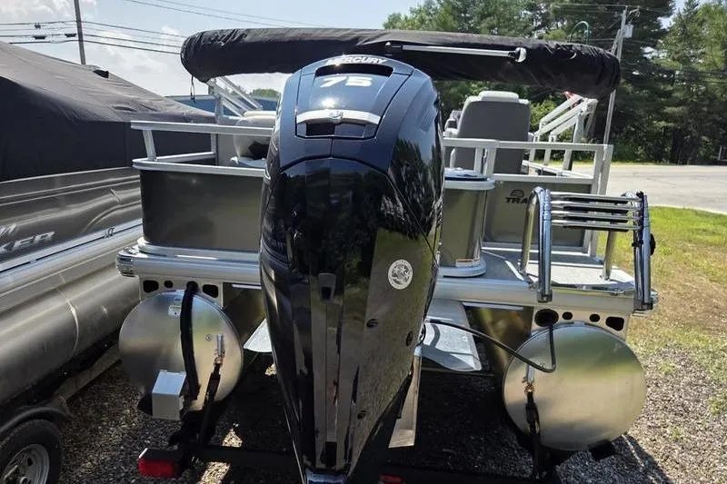 Slide: The Image of 2026 Sun Tracker BB 18 DLX pontoon boat with Mercury 75 engine, parked outdoors. - 3