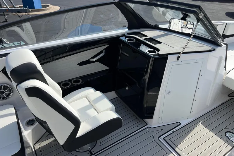 Slide: The Image of 2024 Yamaha Boats 222SE interior with sleek seating and modern dashboard design. - 14