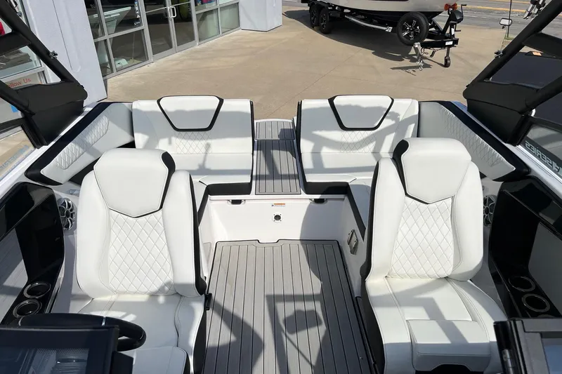 Slide: The Image of 2024 Yamaha Boats 222SE interior with white seating and modern design. - 17