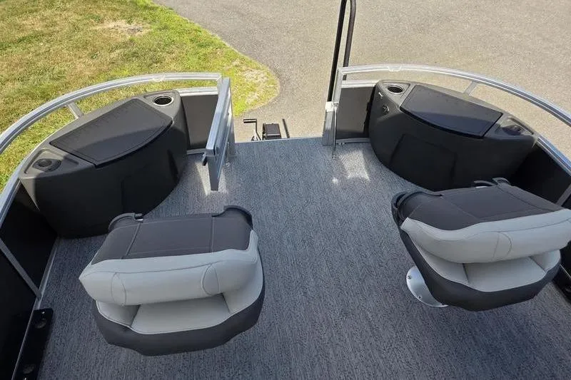 Slide: The Image of 2026 Sun Tracker BB 18 DLX boat interior with seating and cup holders. - 6