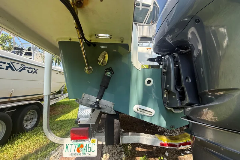 Slide: The Image of 2020 Striper 220 Center Console boat on trailer, Florida license plate visible. - 13