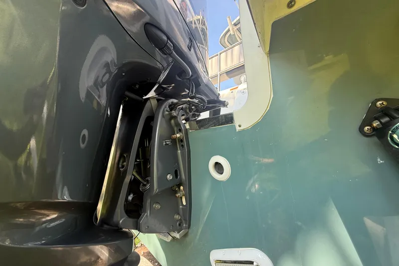 Slide: The Image of 2020 Striper 220 Center Console boat engine and hull close-up. - 15