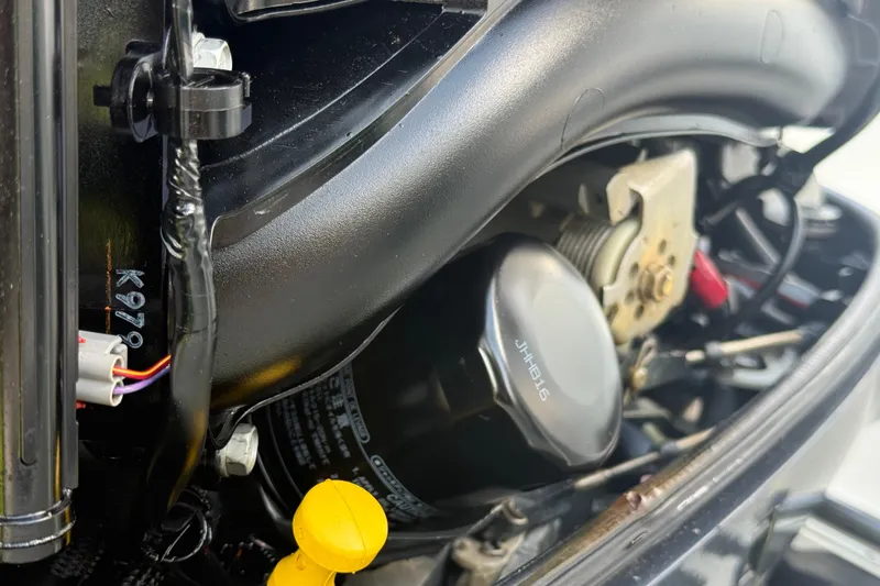 Slide: The Image of Close-up of a 2020 Striper 220 Center Console engine components. - 19