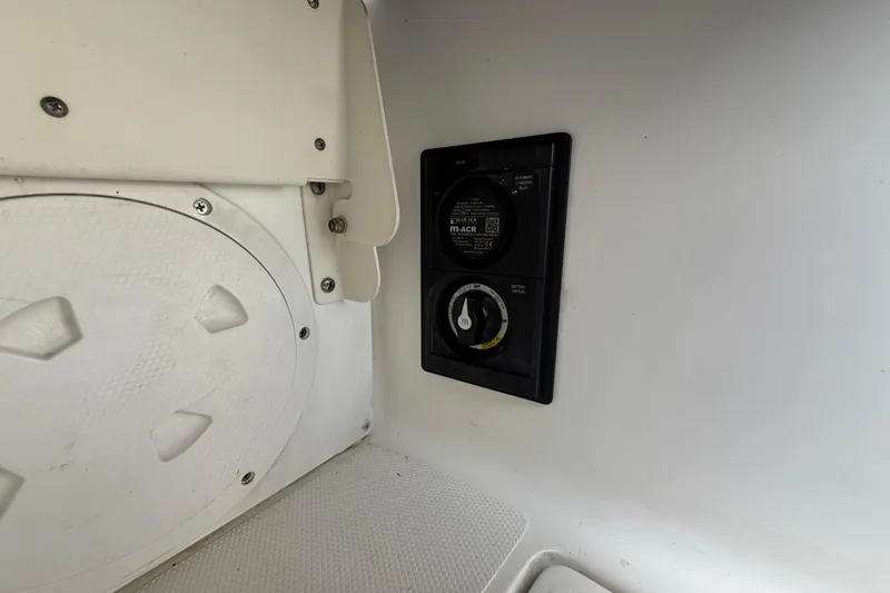 Slide: The Image of 2020 Striper 220 Center Console boat electrical panel and battery switch. - 24