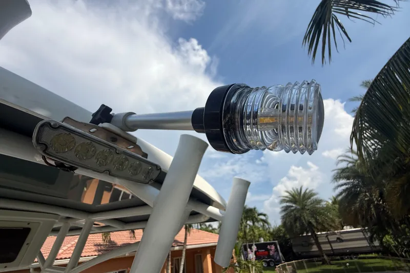 Slide: The Image of 2020 Striper 220 Center Console boat light and antenna against a tropical backdrop. - 29