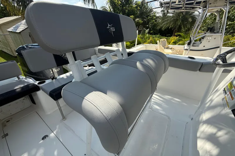 Slide: The Image of 2020 Striper 220 Center Console boat interior with seating and steering wheel. - 31
