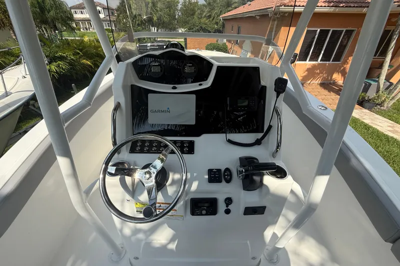 Slide: The Image of 2020 Striper 220 Center Console boat dashboard with Garmin navigation system. - 32