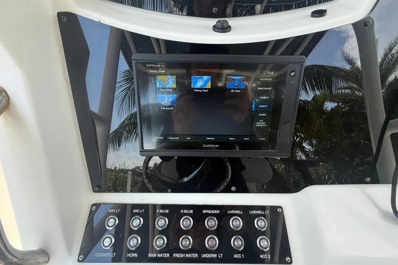 Slide: The Image of 2020 Striper 220 Center Console dashboard with Garmin GPS and control panel. - 34