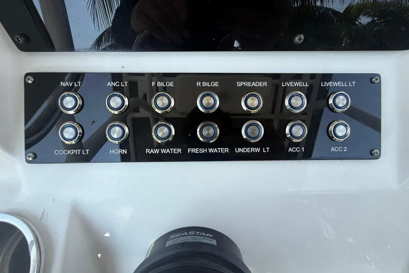 Slide: The Image of Control panel of 2020 Striper 220 Center Console boat with labeled switches. - 35