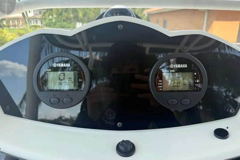 Slide: The Image of Yamaha gauges on 2020 Striper 220 Center Console boat dashboard. - 36