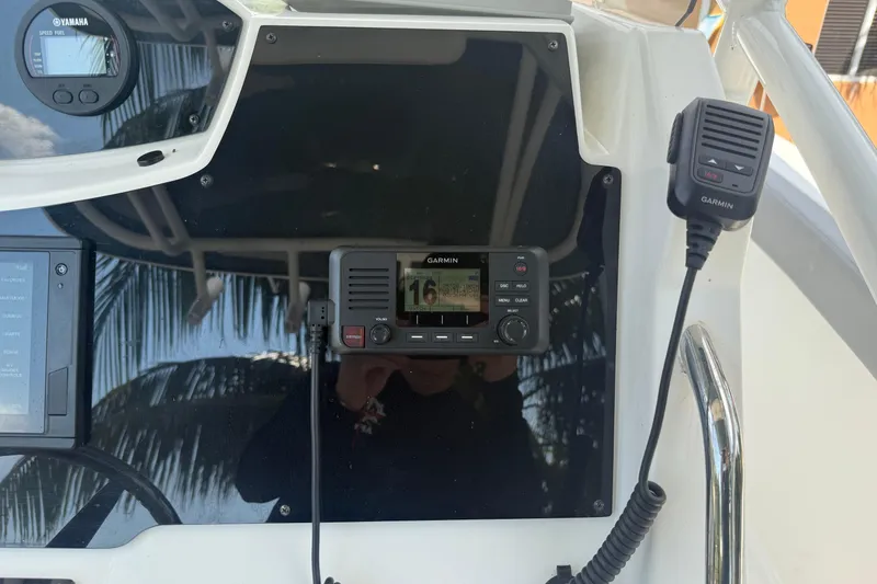 Slide: The Image of 2020 Striper 220 Center Console boat dashboard with Garmin marine electronics. - 39