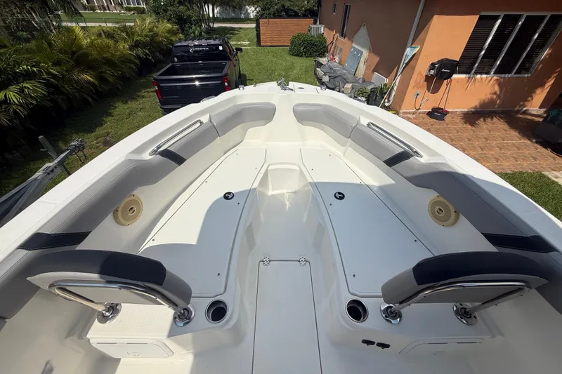 Slide: The Image of 2020 Striper 220 Center Console boat interior with seating and storage compartments. - 47