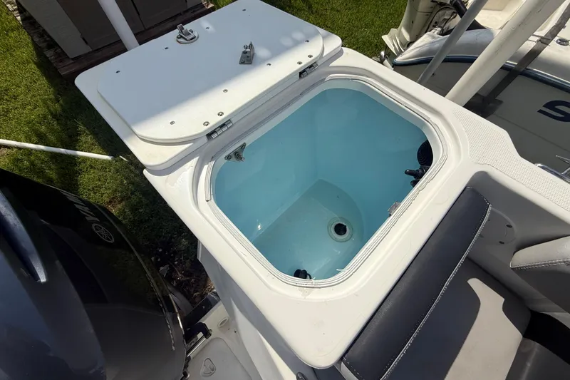 Slide: The Image of Livewell on 2020 Striper 220 Center Console boat, open lid, showing interior. - 50
