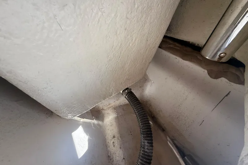 Slide: The Image of Interior view of a 2020 Striper 220 Center Console boat, showing wiring and structural details. - 54