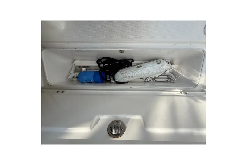 Slide: The Image of Storage compartment of 2020 Striper 220 Center Console with boating accessories. - 61