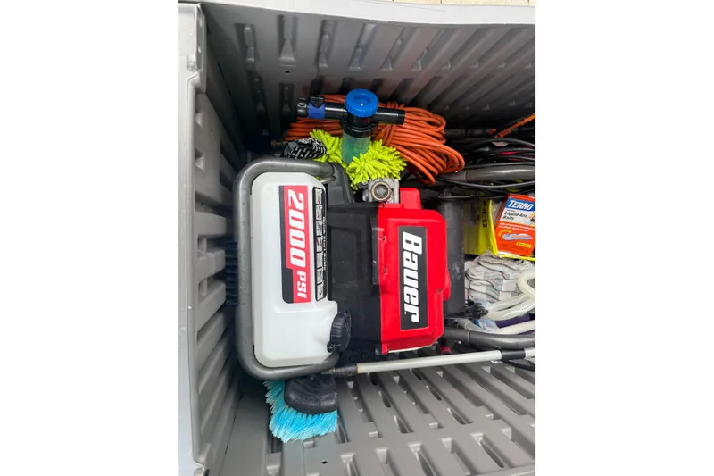 Slide: The Image of Storage box with Bauer 2000 PSI pressure washer and cleaning supplies. - 67